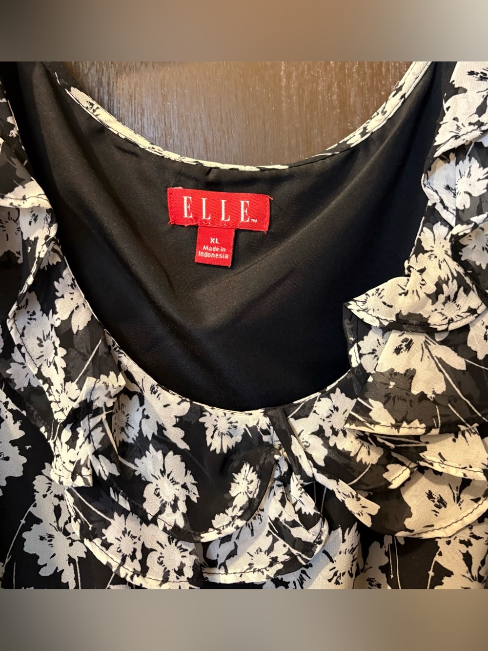 Elle Black & White camisole with 
Floral print & ruffle details.